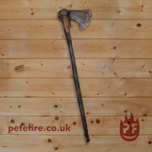hand forged axe with carved wooden handle