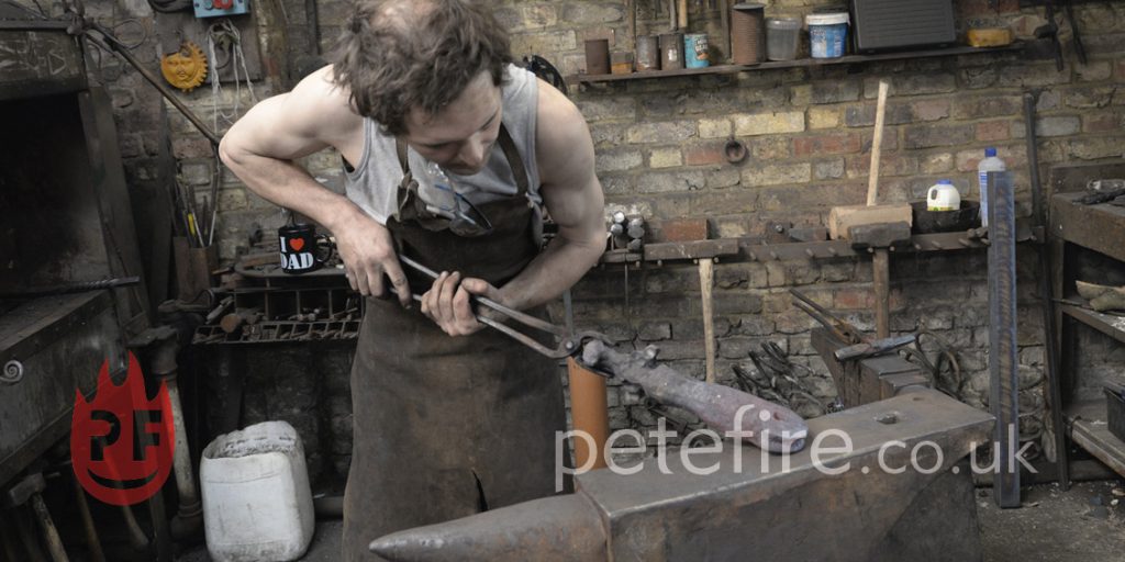 Blacksmith forging at the Herts forge