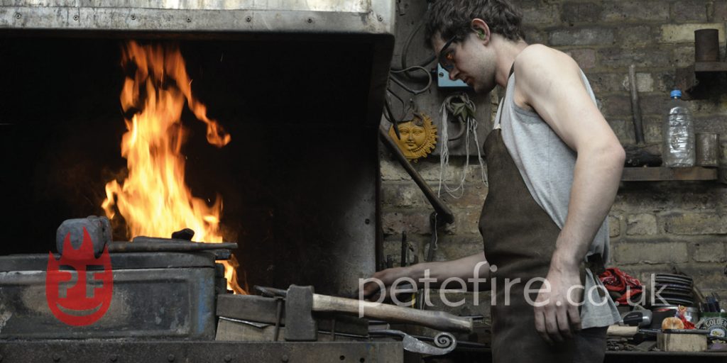 Blacksmith forging at the Petefire forge